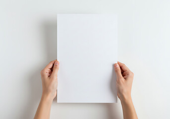 Woman holding blank white board