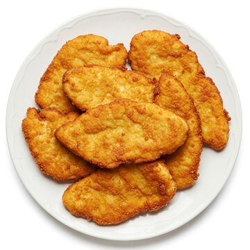 A plate with some spanish escalopa de pollo a la milanesa, breaded chicken fillets