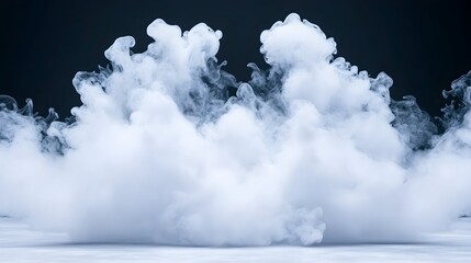 A large cloud of white vapor floats against a dark background, seemingly hovering above a white surface