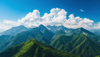 Mountain range with lush forests and blue sky