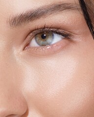Obraz premium Extreme Closeup Of Green Eye With Natural Makeup And Radiant Skin