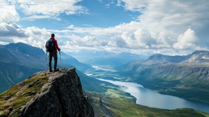 Awe-inspiring mountain vista, solo trekker contemplates scenic beauty