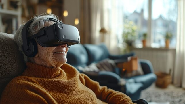 A cheerful senior woman wea a virtual reality headset smiles while sitting comfortably in her living room, enjoying an immersive and futuristic experience.