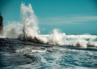 waves crashing on rocks