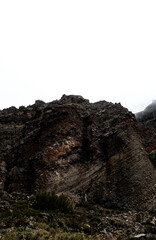 Layered rock formations with horizontal lines, showcasing ancient geological processes and the...