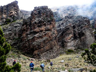 Layered rock formations with horizontal lines, showcasing ancient geological processes and the...