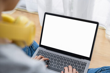 woman using a computer laptop with a blank screen, for putting advertising to promote