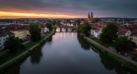 Cityscape View Over River at Dusk with Church and Bridge