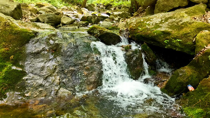 Valley for Summer Vacation ,Slow Motion ,Clear Stream flowing over rocks and rocks ,Rich Valley in slow motion ,Crystal clear water spills over rocks ,Silent natural scene