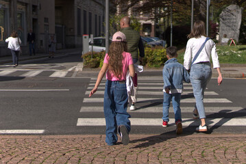 Family crossing the zebra crossing.