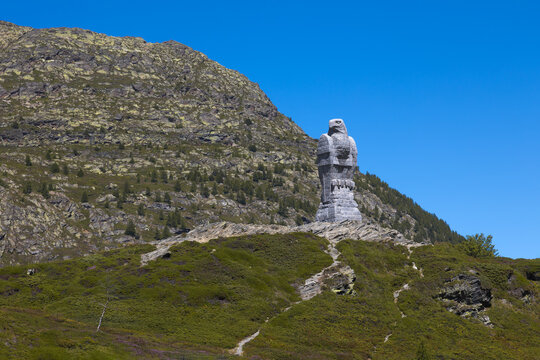 Simplon Pass, Switezrland &ndash; 10 August 2023: The 9m high stone eagle on the Swiss Alp - a symbol of vigilance, created in World War II to honor the "Watch on the Simplon" by the Mountain Brigade 11.