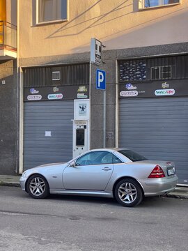 Silver Mercedes-Benz SLK 230 Kompressor Roadster A Stylish Automotive Icon A Classic Car With A Supercharged Engine A Timeless Design And An Open-Air Driving Experience A Vehicle From 2001