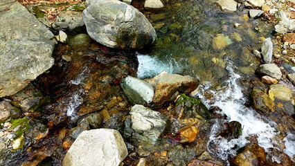 Valley for Summer Vacation ,Slow Motion ,Clear Stream flowing over rocks and rocks ,Rich Valley in slow motion ,Crystal clear water spills over rocks ,Silent natural scene ,Silent flowing riverbed