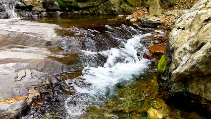 Valley for Summer Vacation ,Slow Motion ,Clear Stream flowing over rocks and rocks ,Rich Valley in...