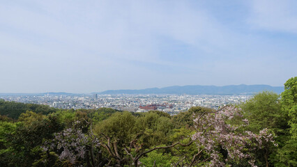 Kyoto, Japan – April 15, 2024: Panoramic view of Kyoto city and surrounding mountains from the summit of Mount Inari, along the path of Fushimi Inari Taisha, one of Japan’s most iconic landmarks.