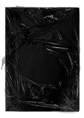A high-resolution abstract texture featuring a torn plastic film wrapping around a solid black background with a central exposed area. This grunge-inspired visual is perfect for creative overlays, exp