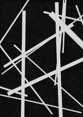 Long thin strips of white paper arranged diagonally across a dark background. The high contrast creates a modern abstract art piece or design overlay.
