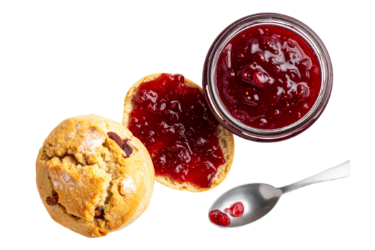 Top view of homemade jam in a jar, with a broken scone and spread, isolated on a transparent background