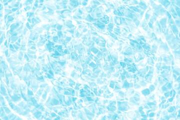 Blue water with ripples on the surface. Defocus blurred transparent blue colored clear calm water surface texture with splashes and bubbles. Water waves with shining pattern texture background.