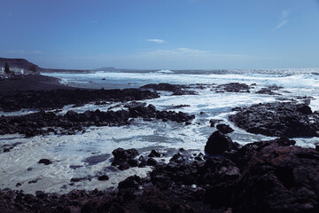 Rocky coast of the Atlantic ocean with waves.