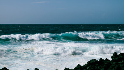 Rocky coast of the Atlantic ocean with waves.