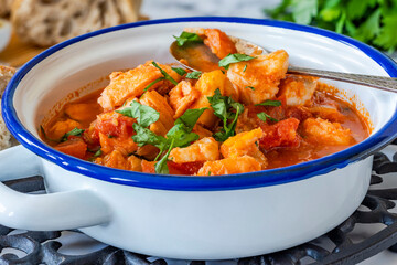 Fish stew made of cod, salmon, smoked haddock and prawns
