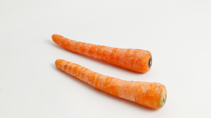 fresh carrots on a plate isolated in white background.  healthy food for kids and vegan. fresh vegetables for cooking.