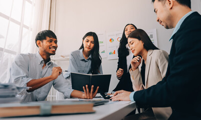 Team of financial advisory services. Asian advisor showing plan of investment to clients in the consultancy office..
