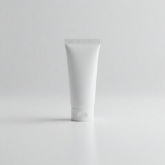 Plain white cosmetic squeeze tube with flip cap on light background