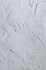 White acrylic illustration textured plaster. Drops, lines, arrows, cracks in close-up. Drawing with a spatula