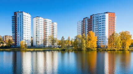 Fototapeta premium Stunning Autumnal Reflection of Modern Apartment Buildings by a Calm Lake