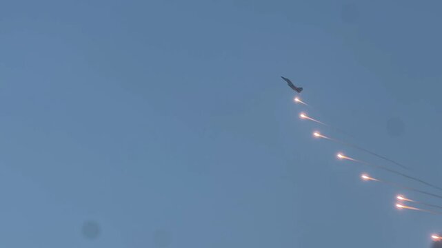 Sukhoi Su-30MKI Indian fighter jet flying above INS Vikrant