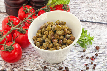 Marinated green capers in the bowl