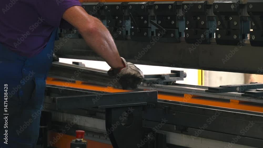 Poster Skillful operator uses metal bending machine for precise shaping of components