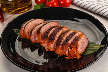 Sliced duck breast baked with cherry