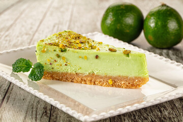 Green pistachio cheesecake served mint