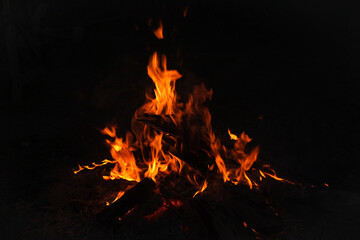 A big bonfire in the yard at night