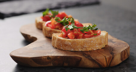 bruschetta with cherry tomatoes and spinach leaves