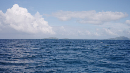 Side view from boat in Indian ocean sailing between Seychelles islands in daytime