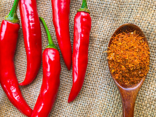 top view of red hot chili peppers powder on a burlap