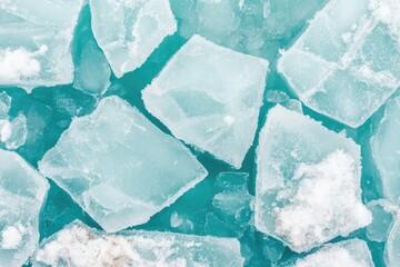 Frozen shards of ice on a teal surface