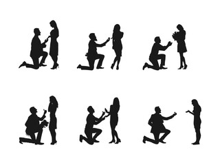 A man standing on one knee and holding an engagement ring is proposing to a pretty woman. Silhouette of a male shadow making a proposal to a surprised lady, marriage.