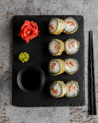 Japanese sushi rolls on a blackboard