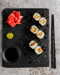 Japanese sushi rolls on a blackboard