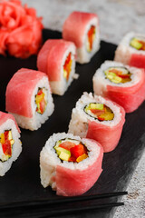 Japanese sushi rolls on a blackboard