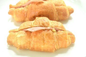 baking crispy butter croissant French bread stuffed ham cheese and spinach on plate