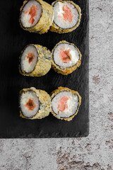 Japanese sushi rolls on a blackboard