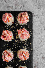 Japanese sushi rolls on a blackboard