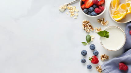 Healthy breakfast ingredients: yogurt, berries, oats, walnuts, and orange slices arranged on a light gray surface, offering copy space. : Generative AI