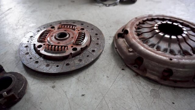 Car service. new and worn car clutch. Car repair concept. Car maintenance